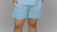 Blue cotton lounge shorts with pockets for casual comfort.