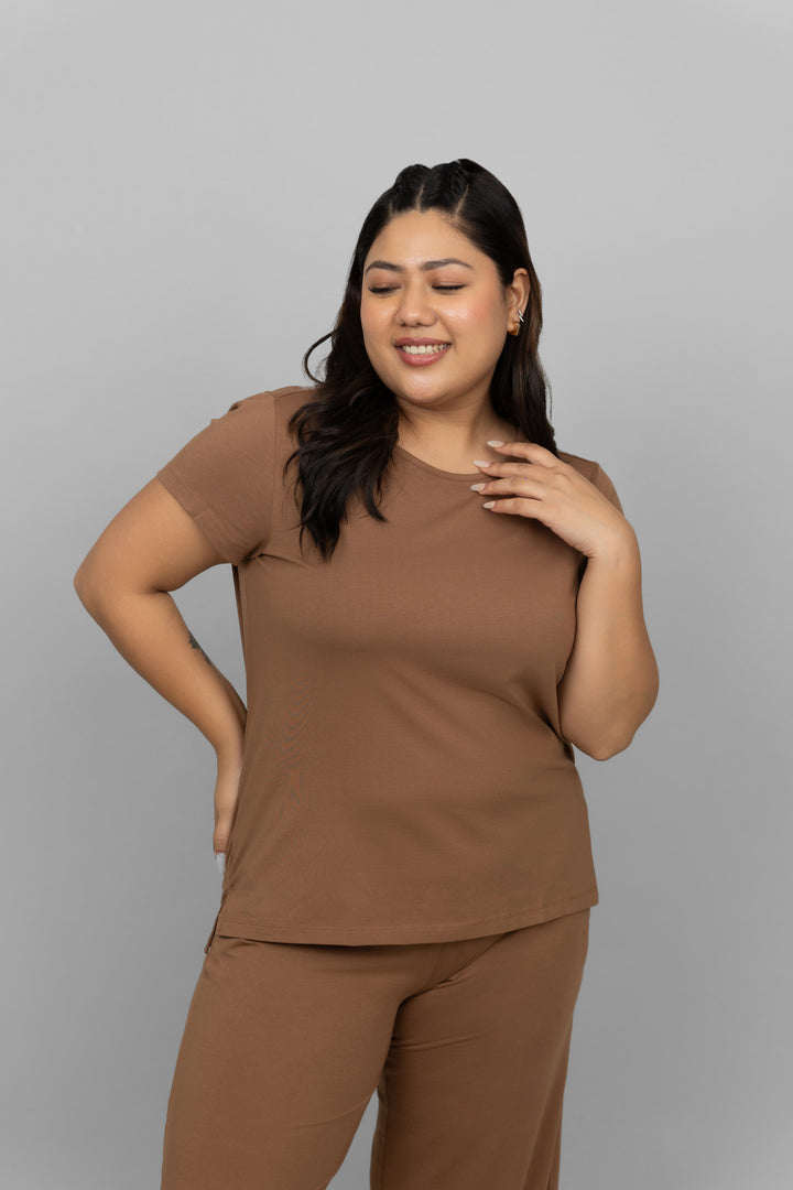 Home Brown Round Neck Top model posing stylishly in a casual outfit.