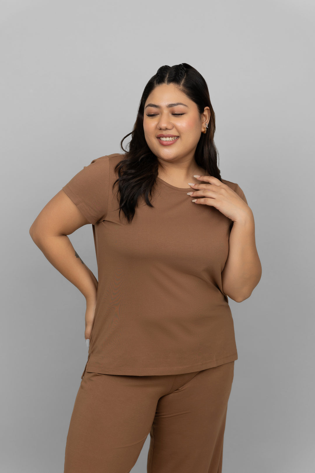 Brown Supima co-ord set model posing in relaxed outfit.