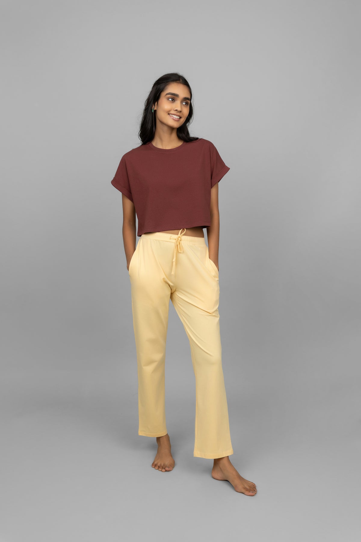 Yellow cotton Lycra pants styled with a brown cropped top.