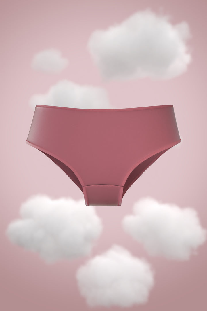 Supima Brief Nessies in a soft pink background with clouds.