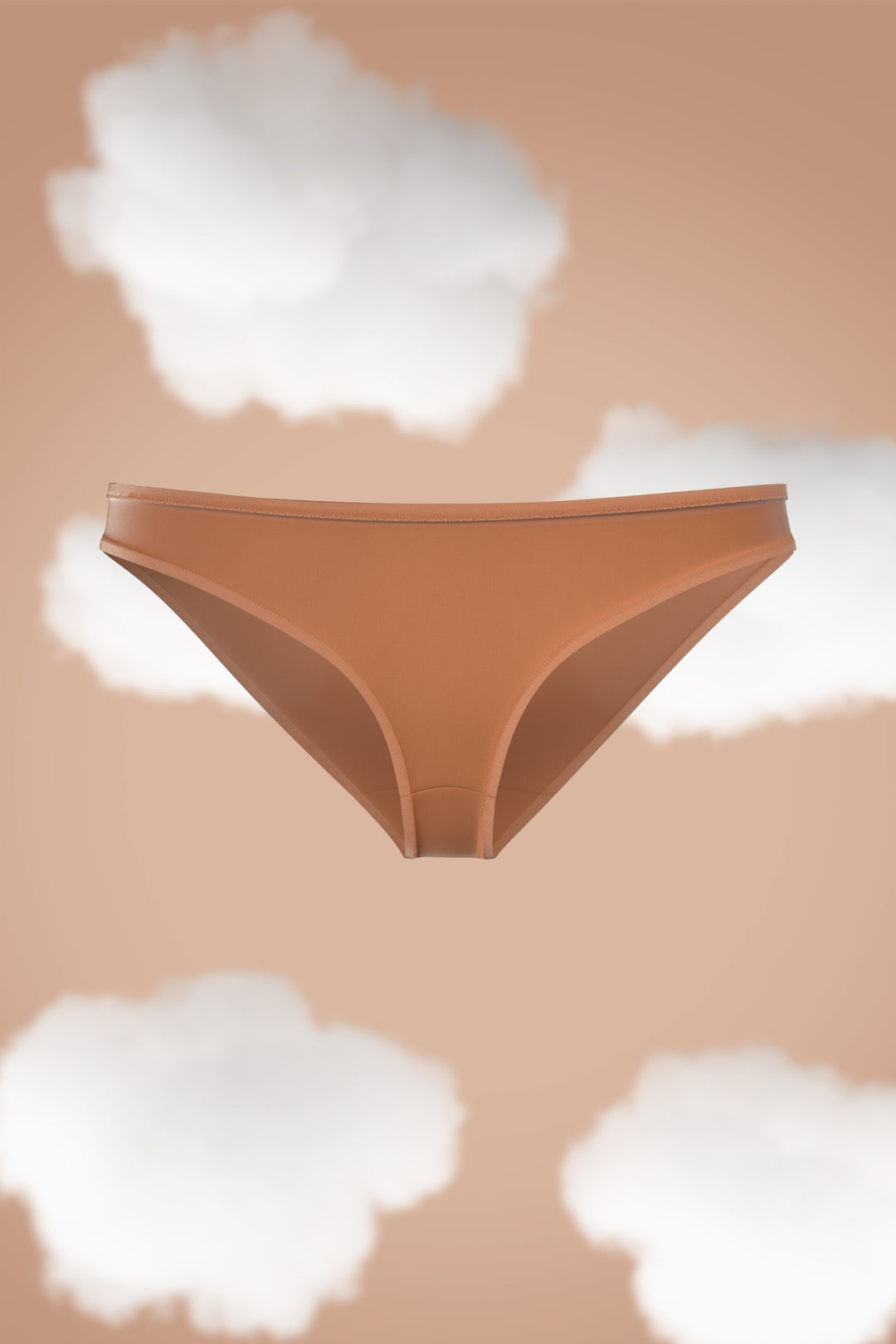 Supima Modal Bikini Nessies in soft brown against a clouded background.