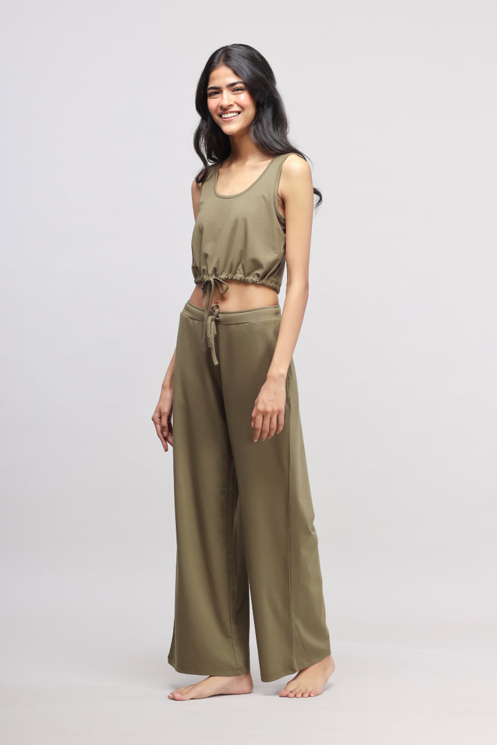 Olive Supima® drawstring co-ord set worn by a smiling model.
