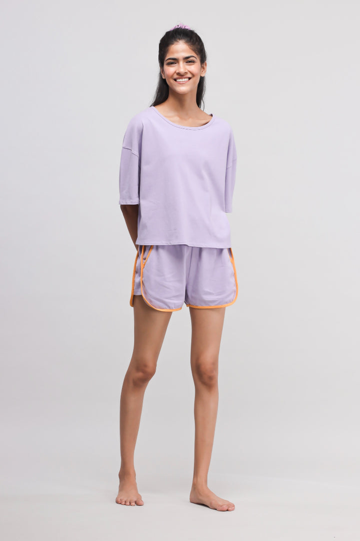 Boxy purple cotton shorts set for comfortable summer wear.