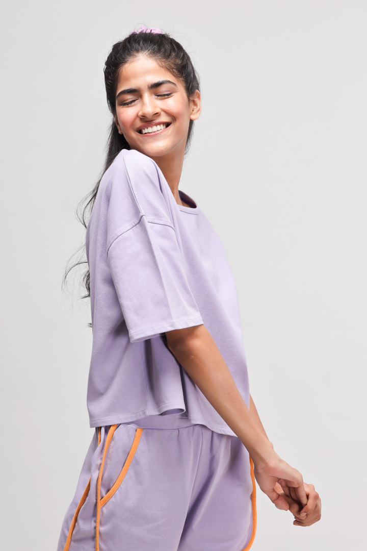 Boxy purple cotton shorts set with relaxed fit and vibrant details.