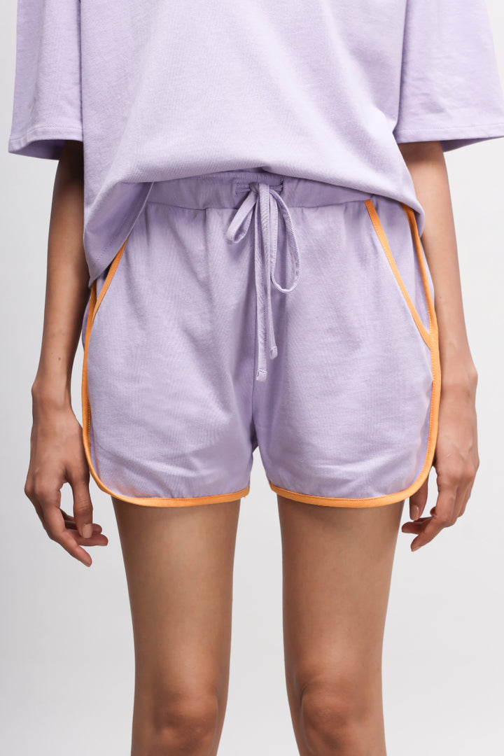 Boxy purple cotton shorts set with orange accents for casual style.