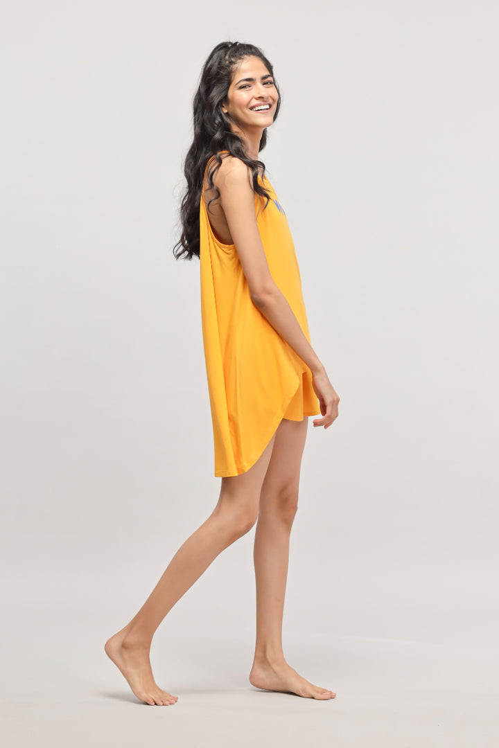 Model wearing Butterfly Shorts Set in vibrant yellow.