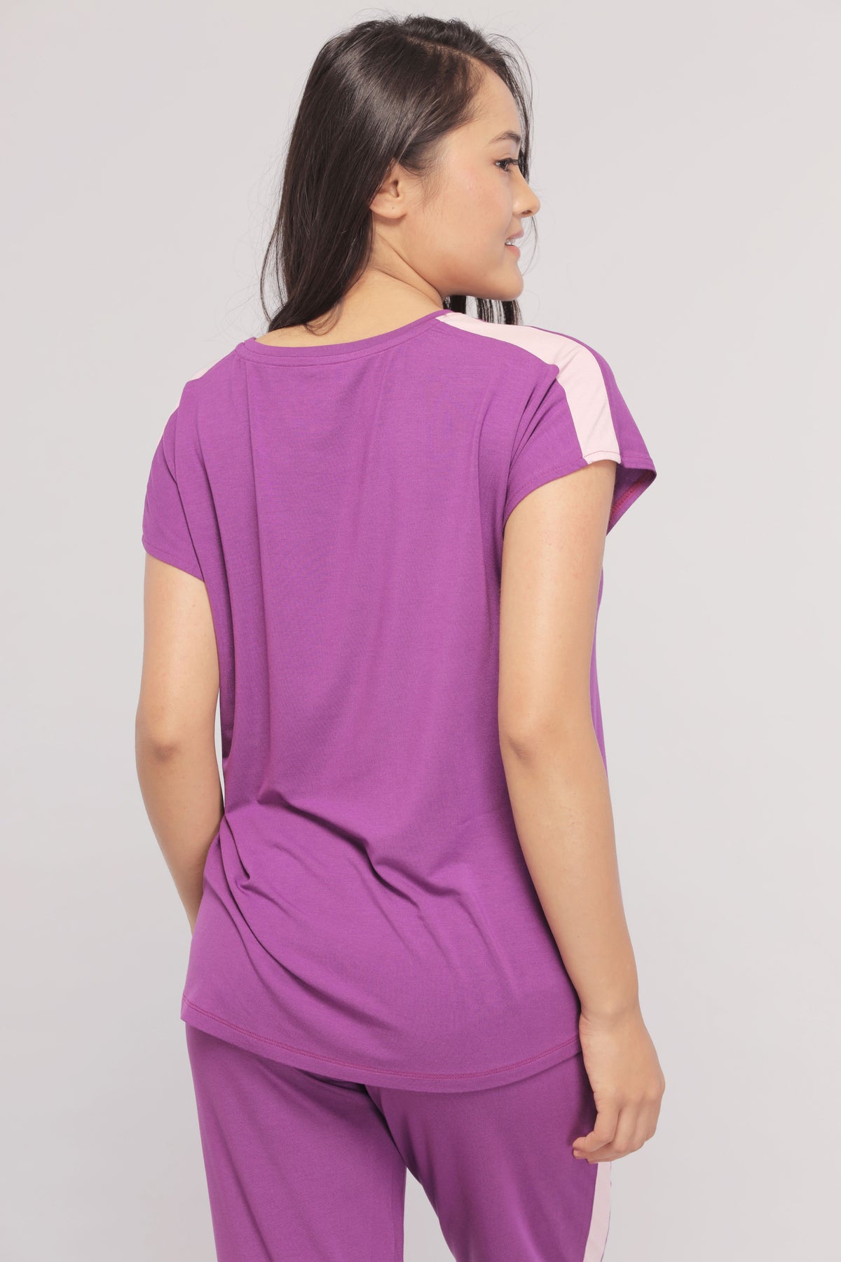 Royal purple top with pink stripe, stylish and trendy women's wear.
