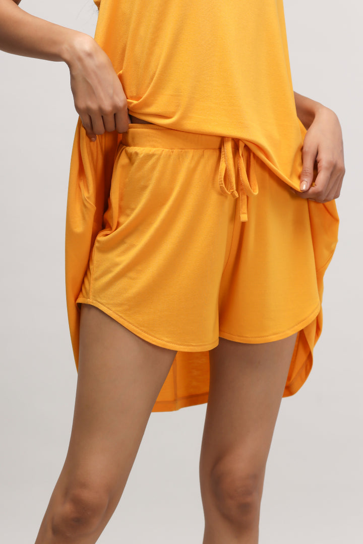 Butterfly Mango Shorts in vibrant yellow with comfortable pockets.