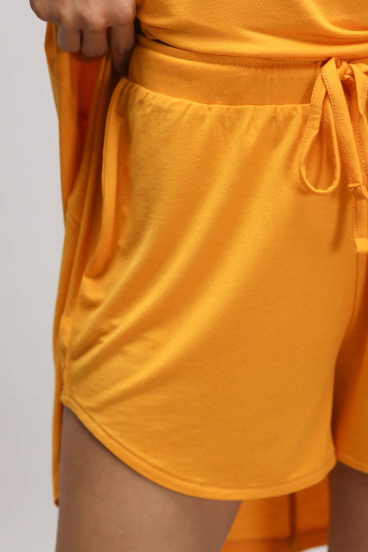 Butterfly Mango Shorts in vibrant yellow with stylish pockets.