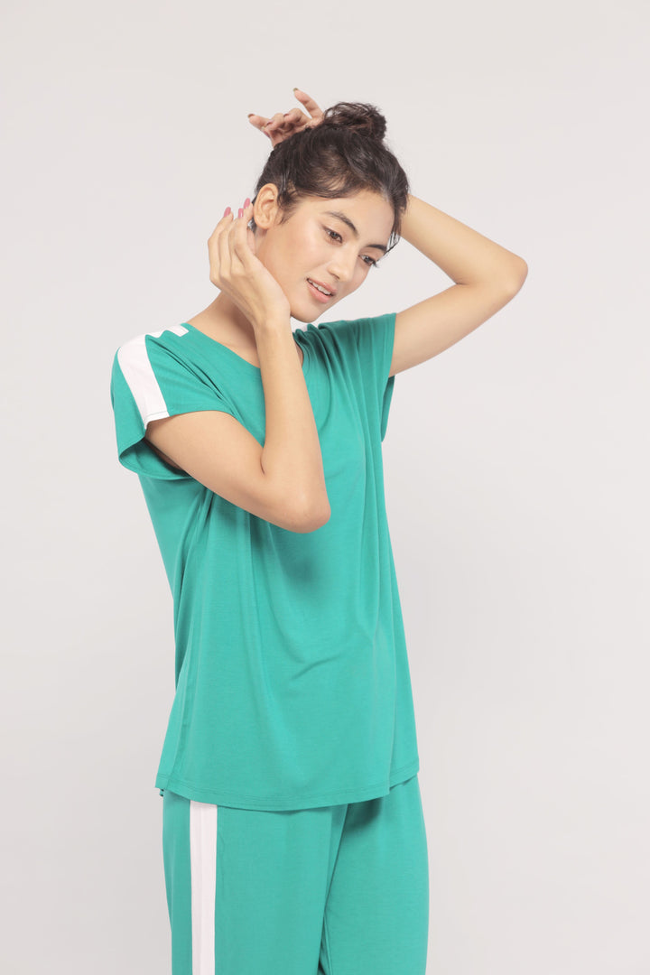 Cozy green lounge top with white stripe, stylish and comfortable.