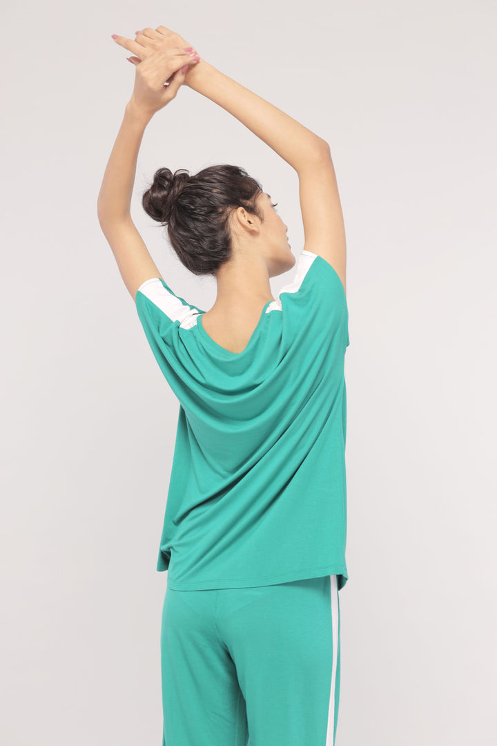 Cozy green lounge top with white stripes, perfect for relaxed wear.