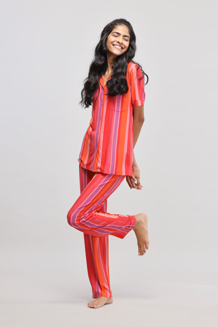 Red Stripe Pajama Set model showcasing vibrant, colorful loungewear.