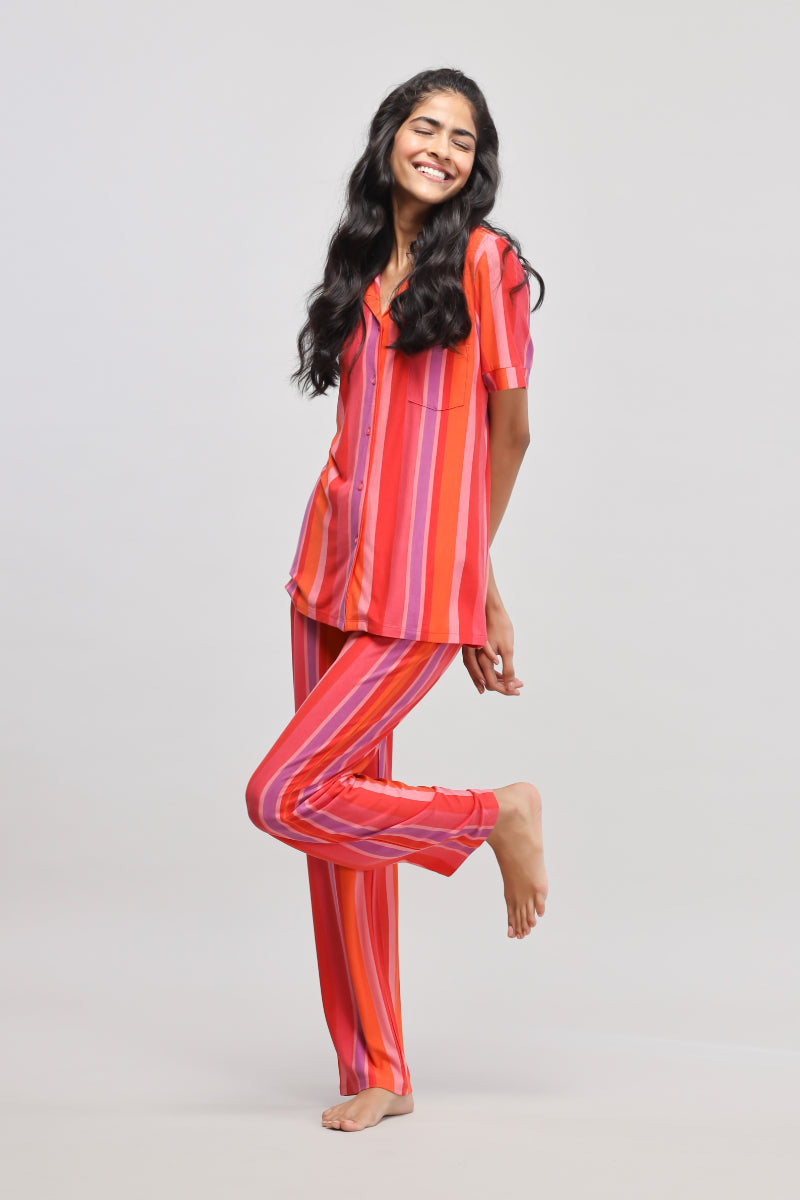 Stylish red striped top paired with matching pants for women.