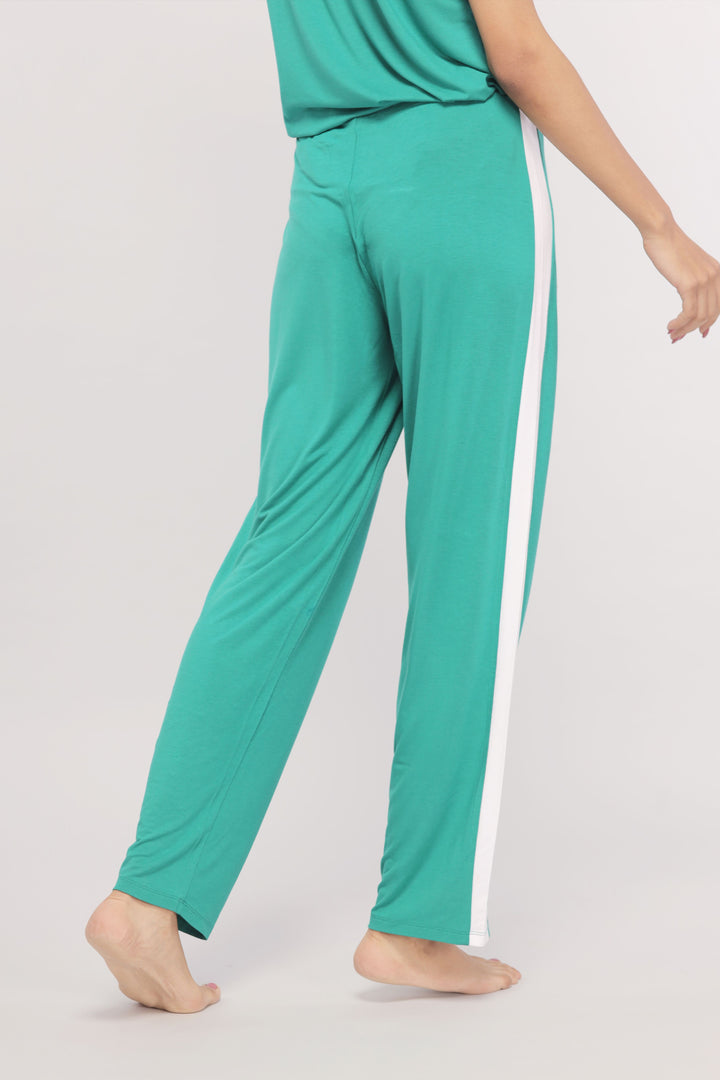 Cozy green pants with white stripe for comfortable lounging.