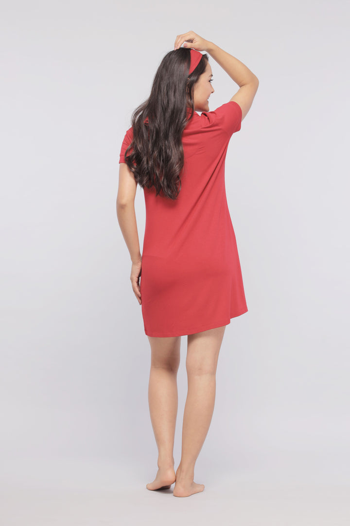 Back view of a woman in a romantic red lace dress.