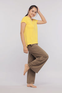 Woman modeling military olive flared Supima lounge set in yellow top.