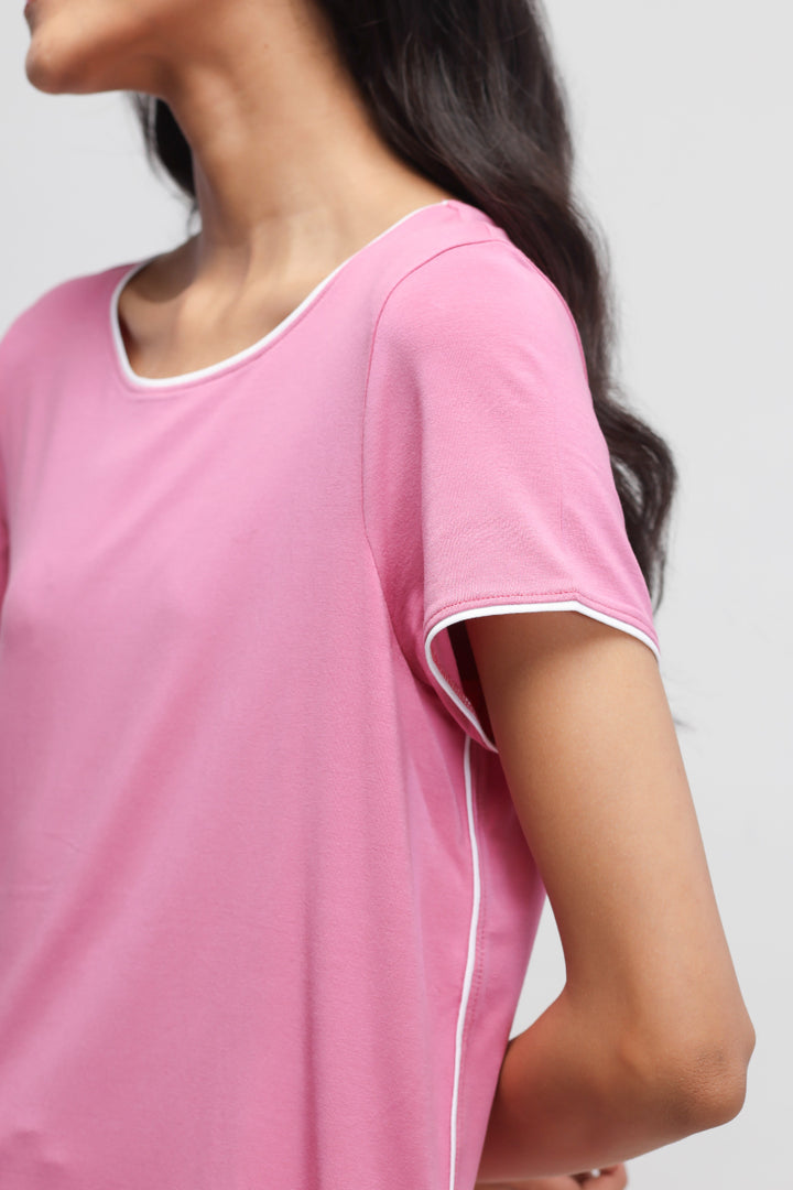 Rose pink top with white piping, stylish casual wear.