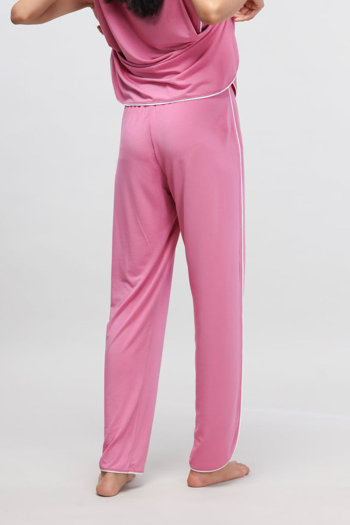 Rose pink pajama set with white piping, stylish and comfortable.