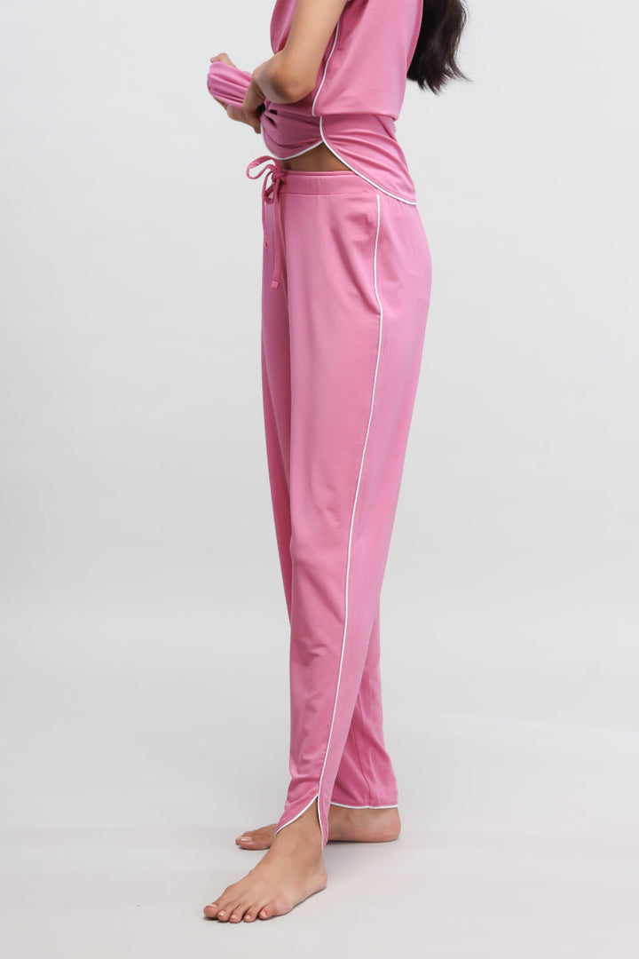 Rose pink pajama set with white piping, stylish and comfortable.