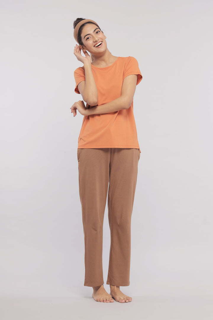 Golden Ochre Supima® Round Neck Tee on a smiling woman.