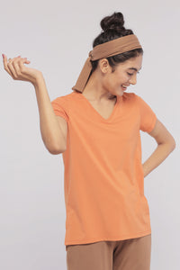 Golden Ochre Supima® V Neck Tee styled for casual elegance.