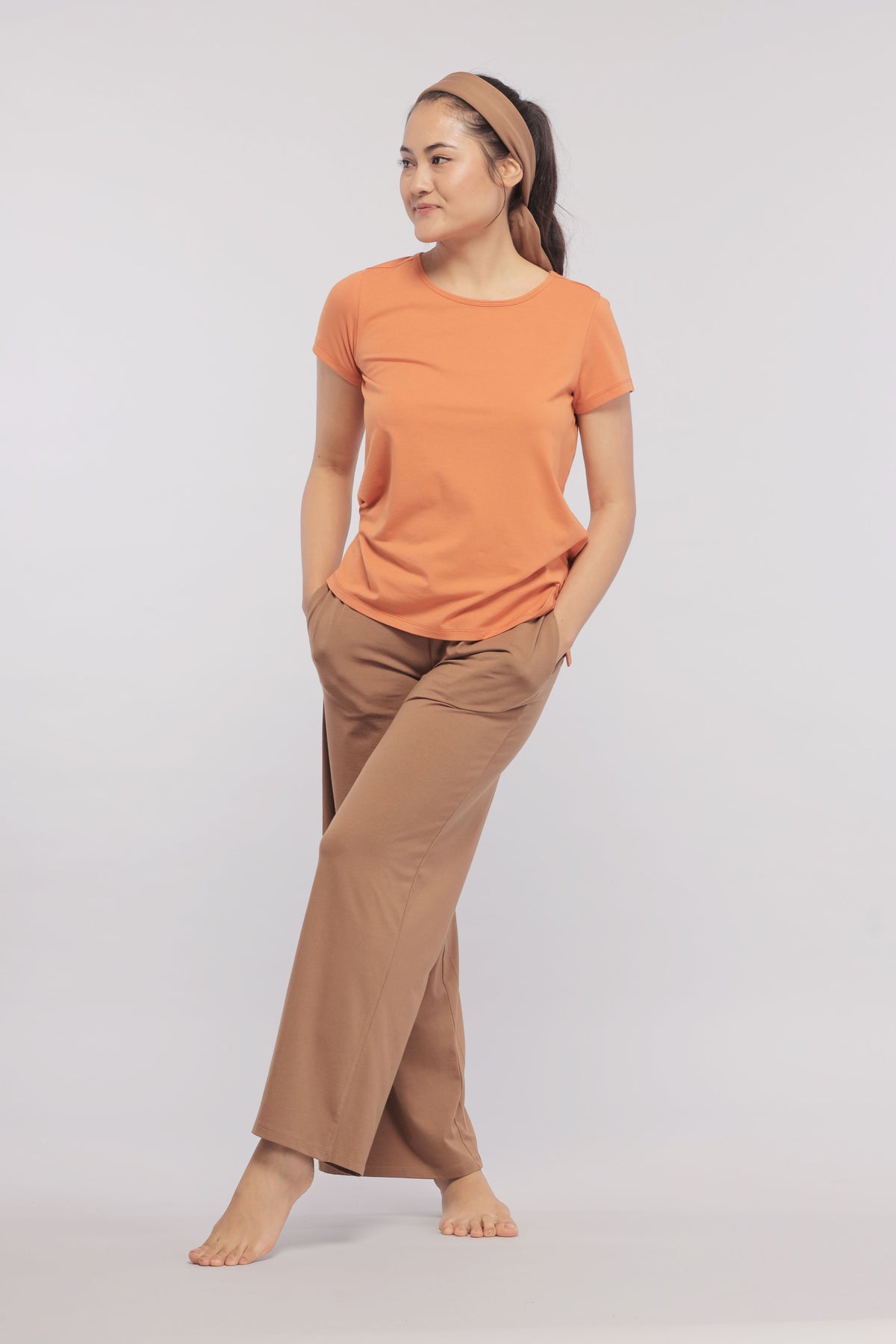 Home Brown Flared Supima® Lounge Pant worn with orange top.