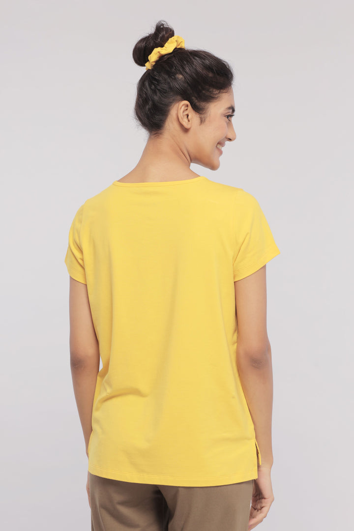 Back view of a woman wearing a yellow lounge set.