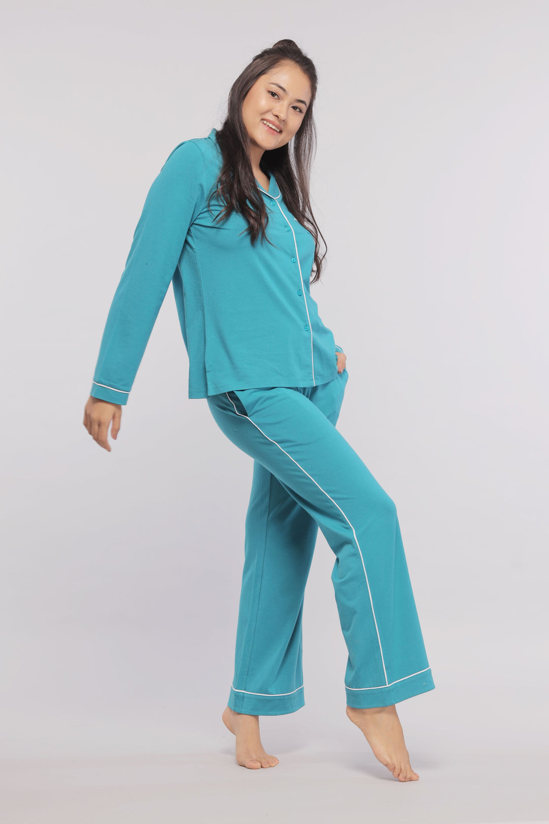 Teal full sleeve button down tee with white piping for women.