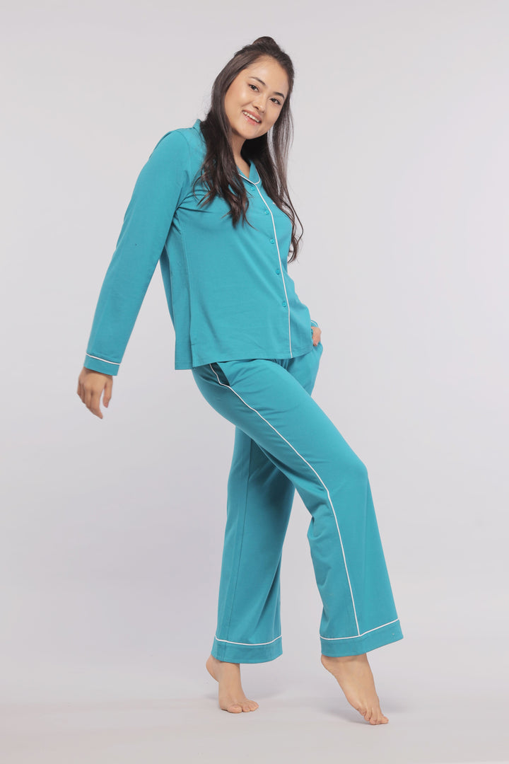 Teal pajamas with white piping, perfect for comfort and style.