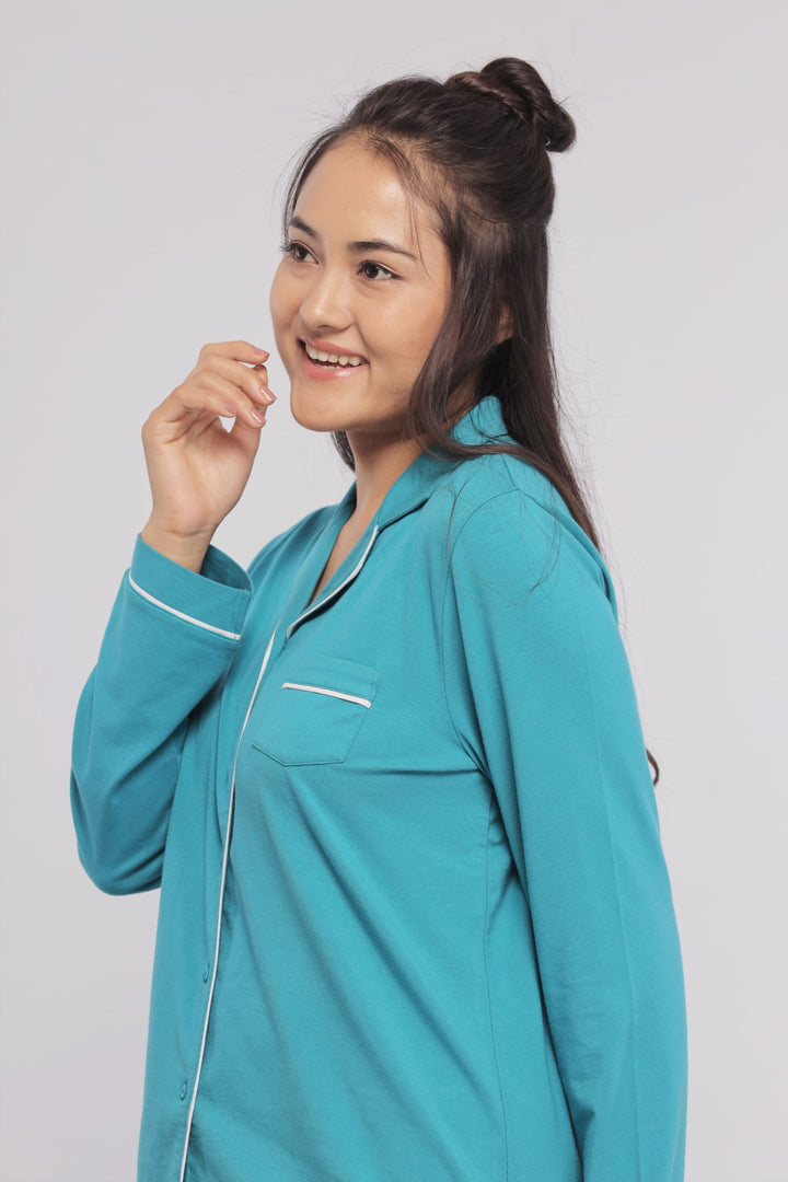 Teal full sleeve button down tee with white piping detail.