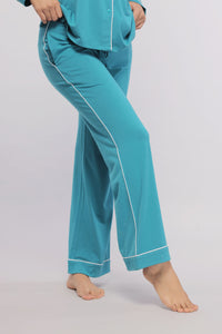 Teal pajamas with white piping, stylish and comfortable loungewear.