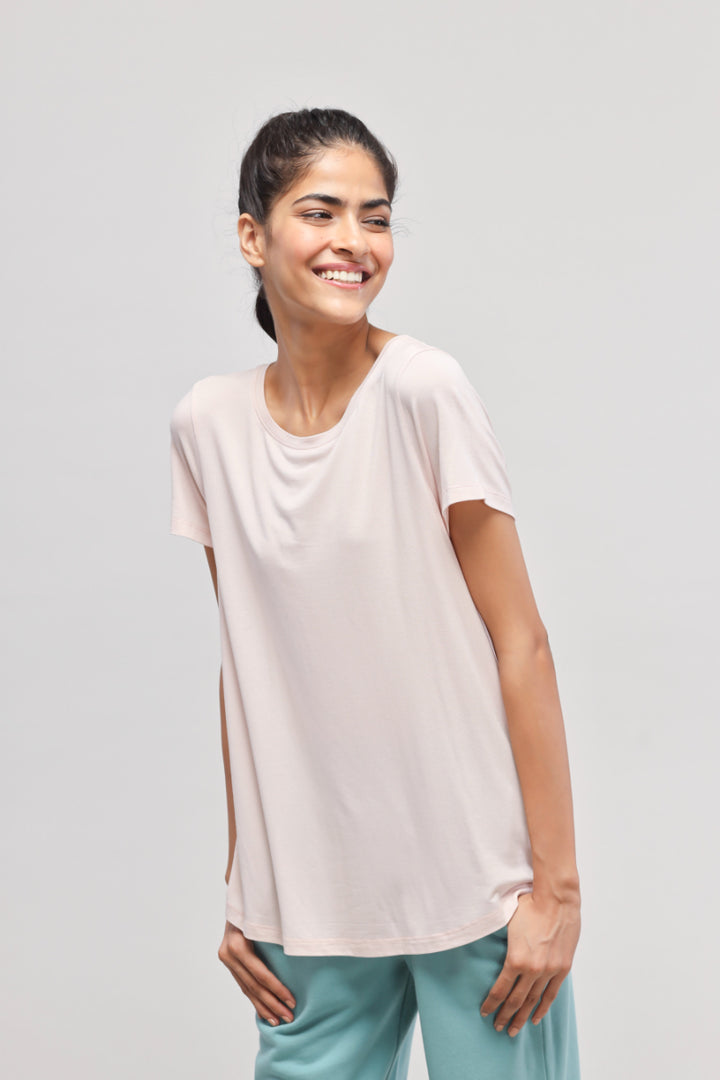 Light pink top from Aqua Terry travel set for stylish comfort.