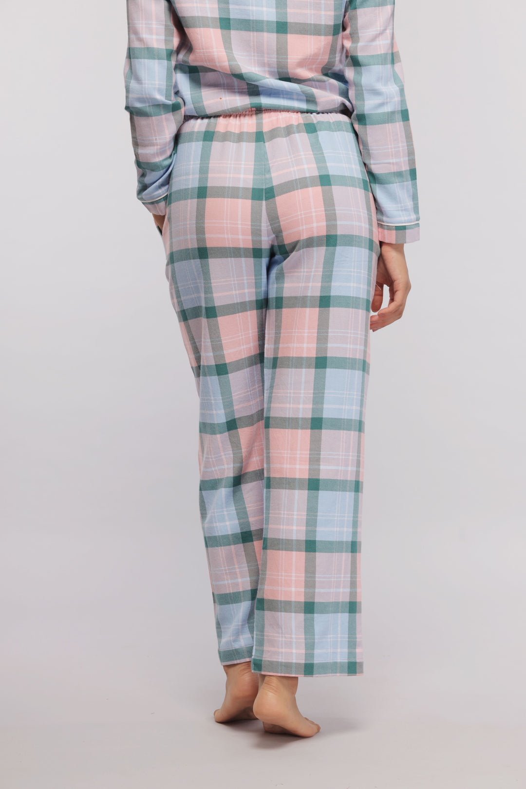 Back view of cozy plaid flannel pajama set for women.