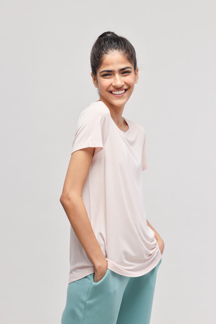 Light pink Aqua Terry travel set top on smiling model.