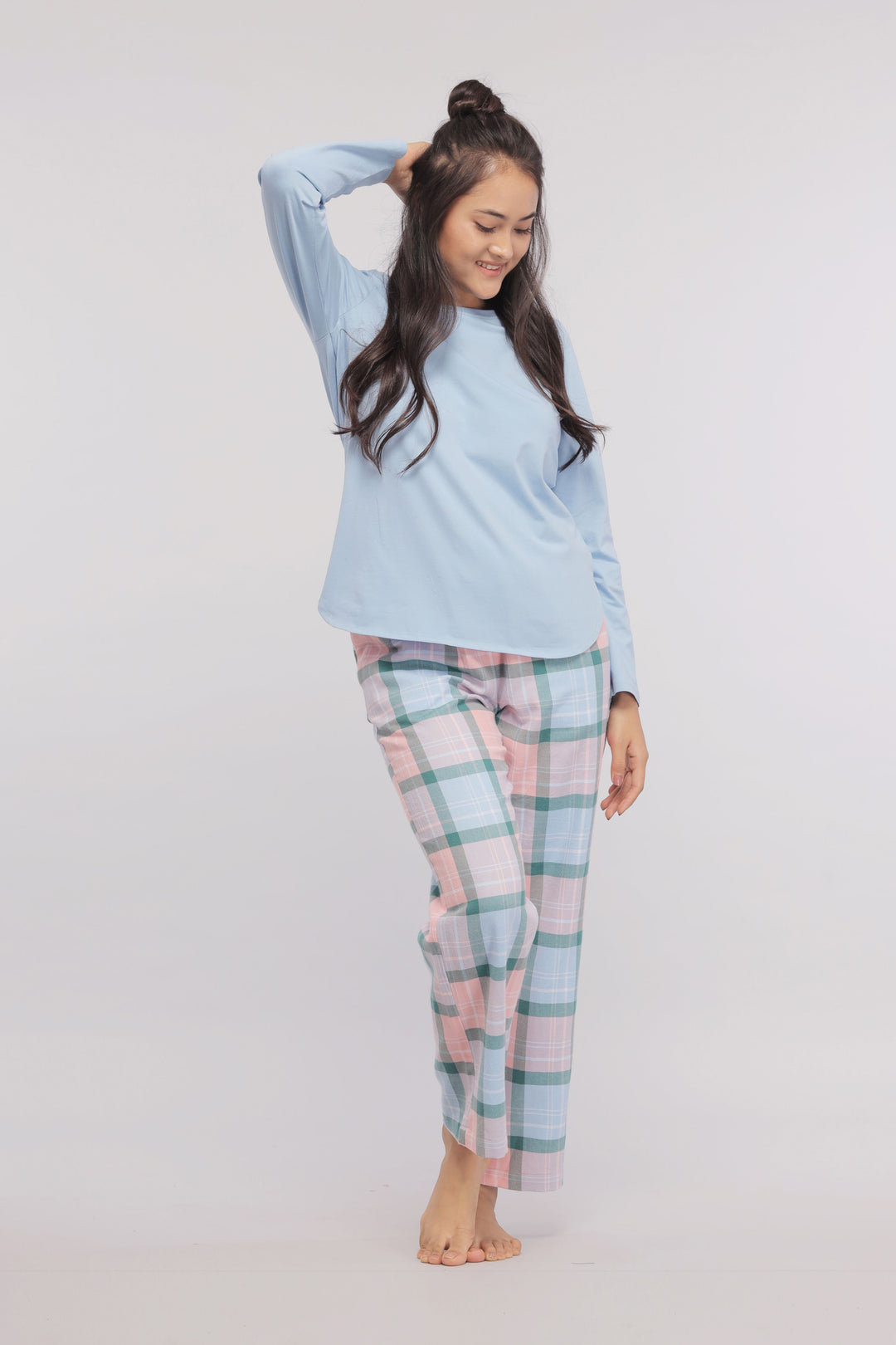 Long sleeve blue cotton sleep top with checkered pants.