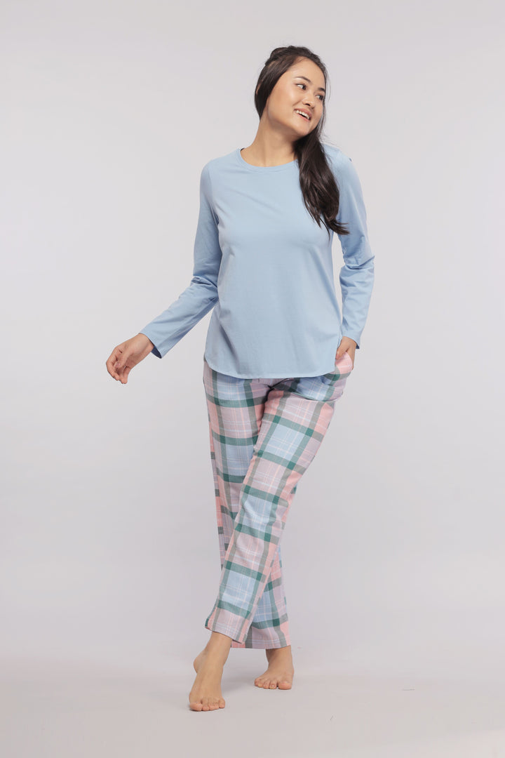 Long sleeve blue cotton sleep top for women with plaid pants.