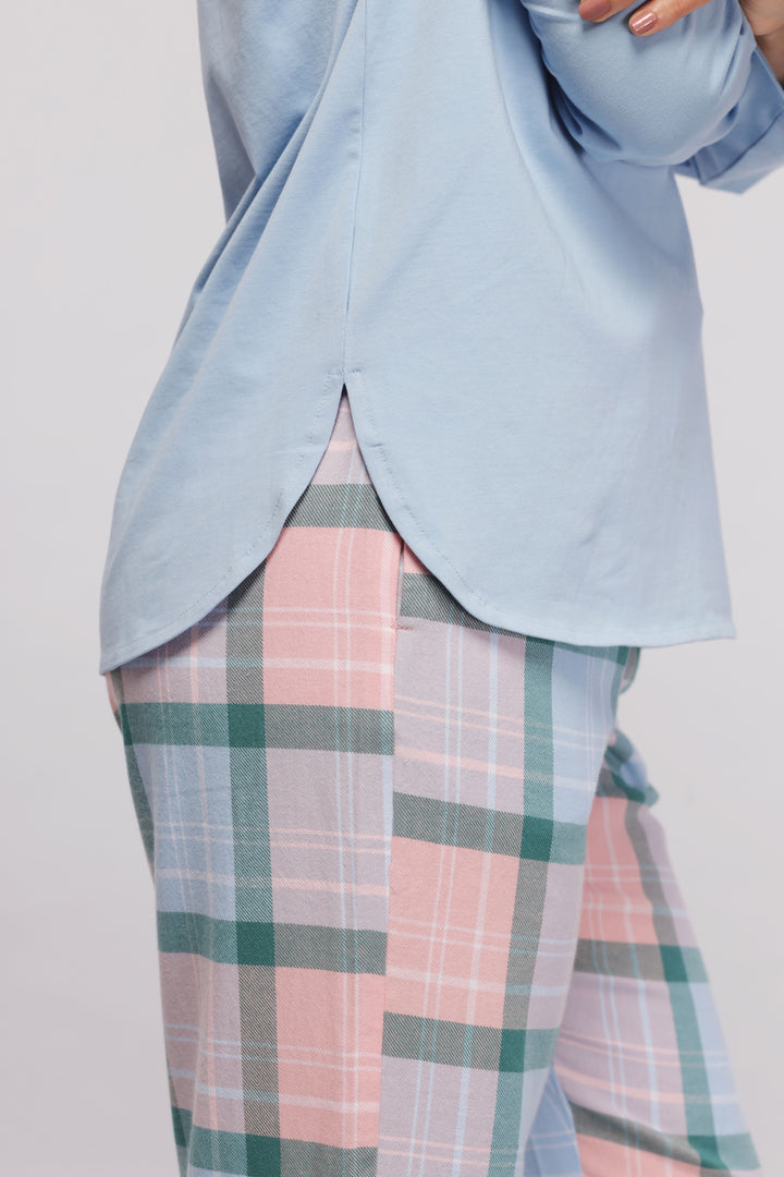 Long sleeve blue cotton sleep top with plaid pajama pants.