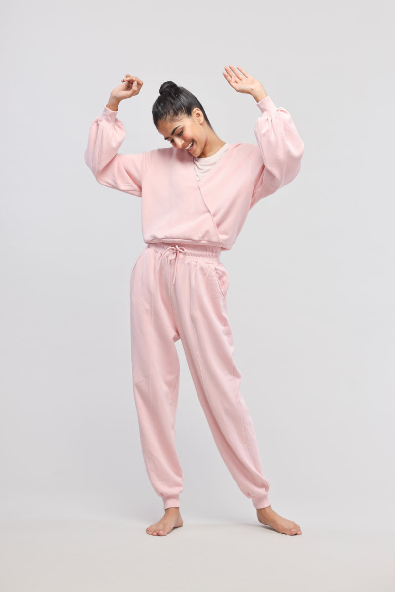 Pink terry travel joggers for stylish comfort and versatility.