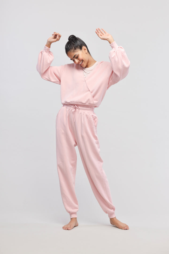 Pink terry travel joggers for stylish comfort and versatility.