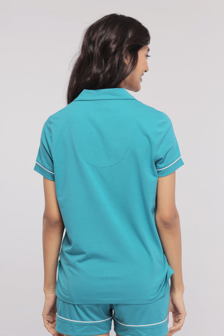 Teal shorts set with white piping, stylish and comfortable for summer.