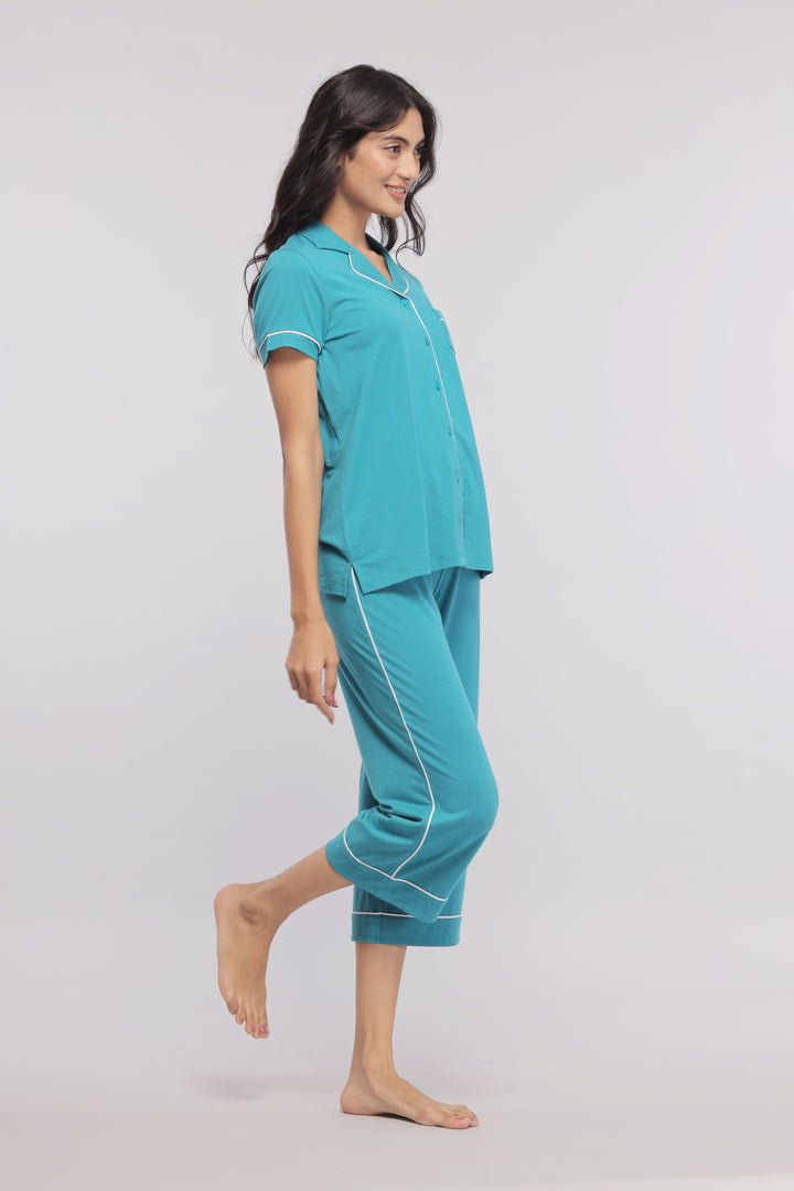 Teal capris with white piping, stylish and comfortable loungewear.
