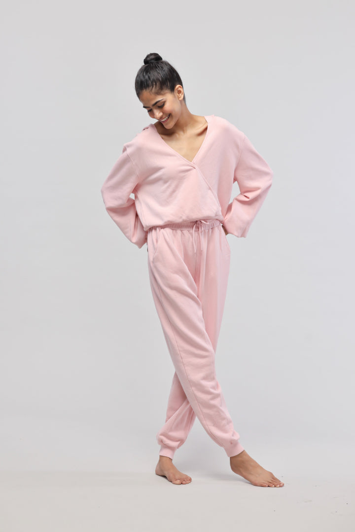 Model showcasing a stylish pink terry hoodie outfit.