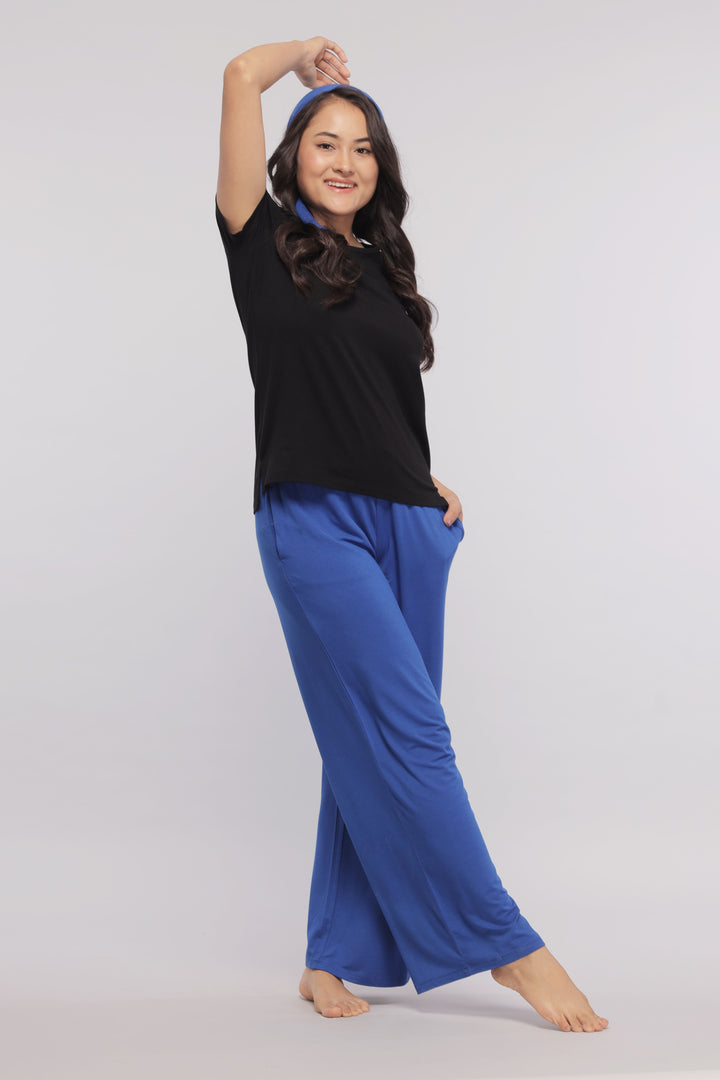 Model wearing True Blue Flared Lounge Pant and black top.