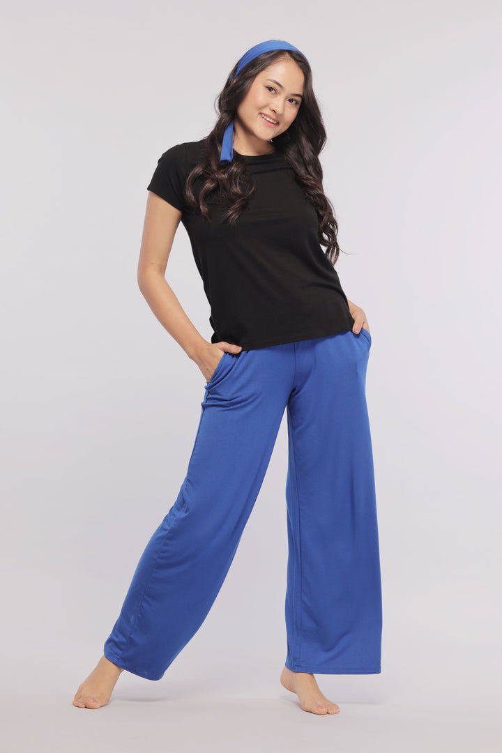 True Blue Flared Lounge Pant worn by model with black top.