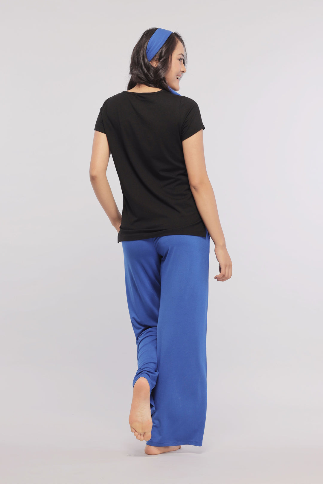 True Blue Flared Lounge Pant worn by a woman, showing back view.