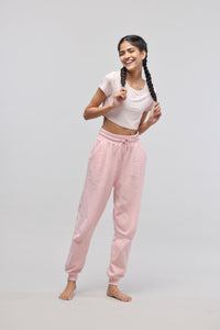 Pink Terry Set with light pink crop top and pants, model posing happily.