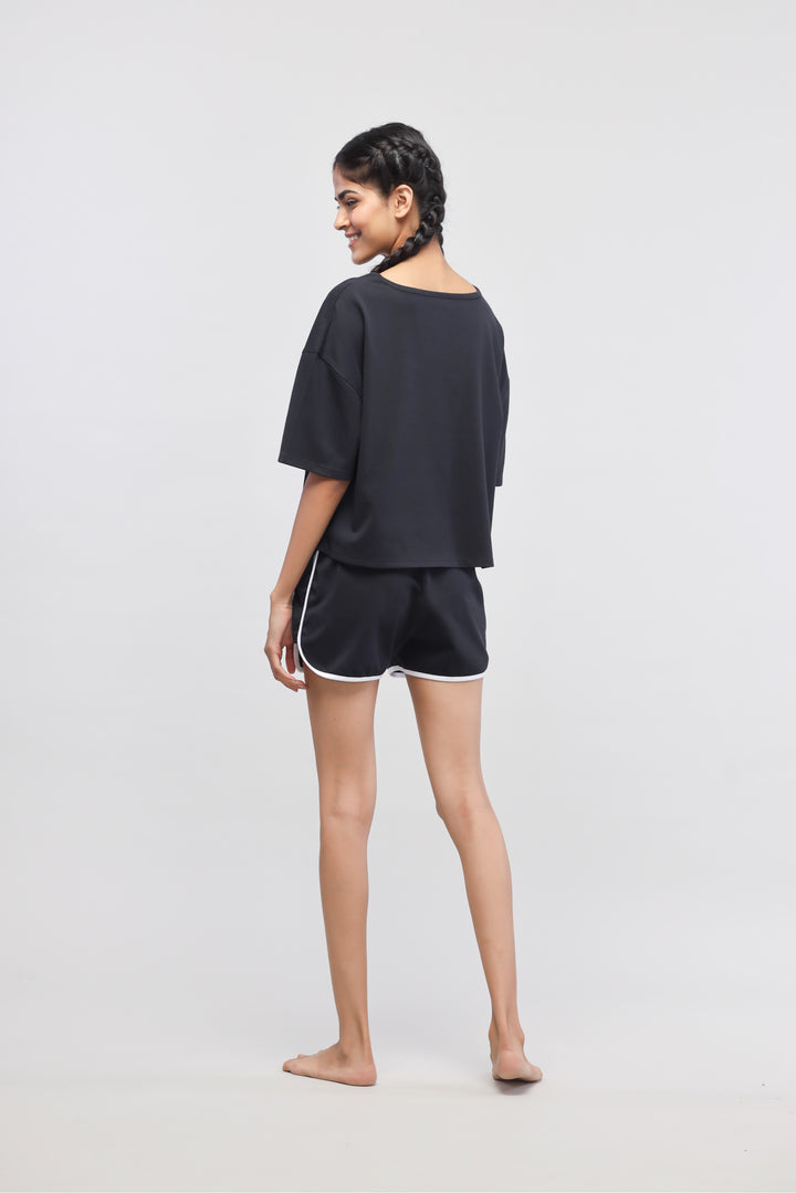 Boxy black cotton shorts set for women, stylish and comfortable.