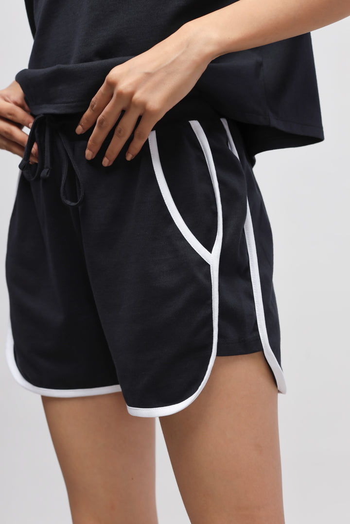 Boxy black cotton shorts set with white trim details.