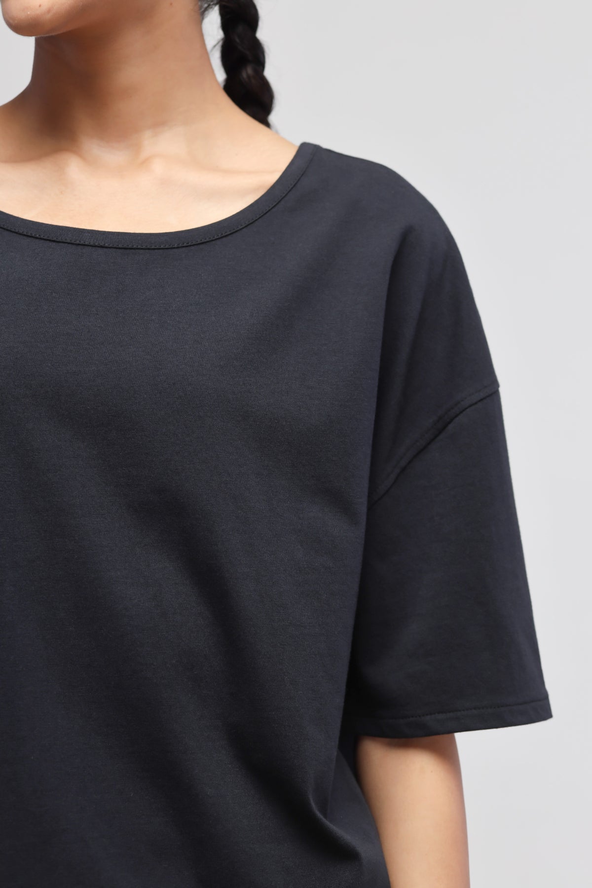 Boxy black cotton top for casual and stylish outfits.